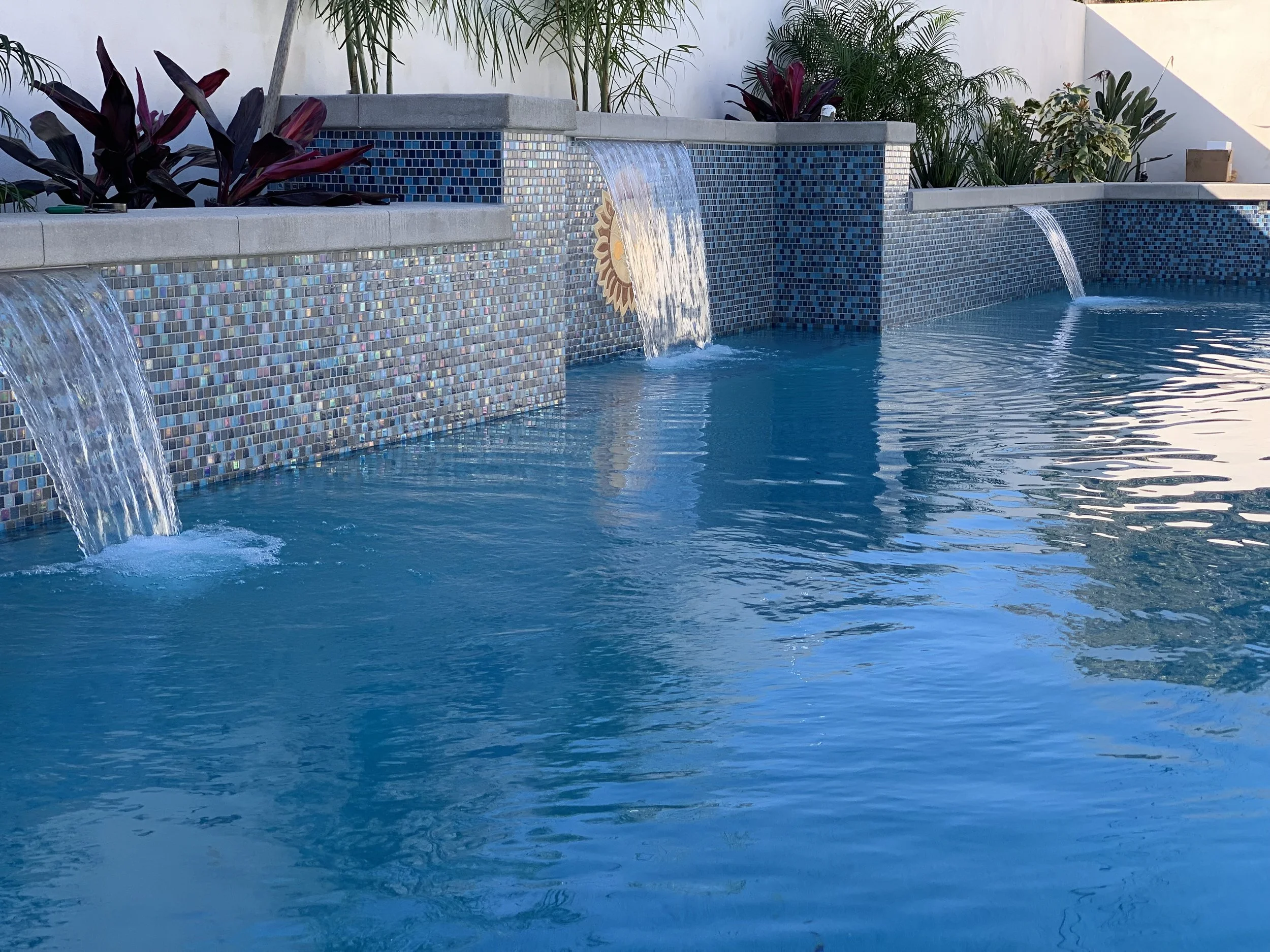 Illuminated pool at night with LED lighting — JSQ Improvements custom pool construction Huntington Beach