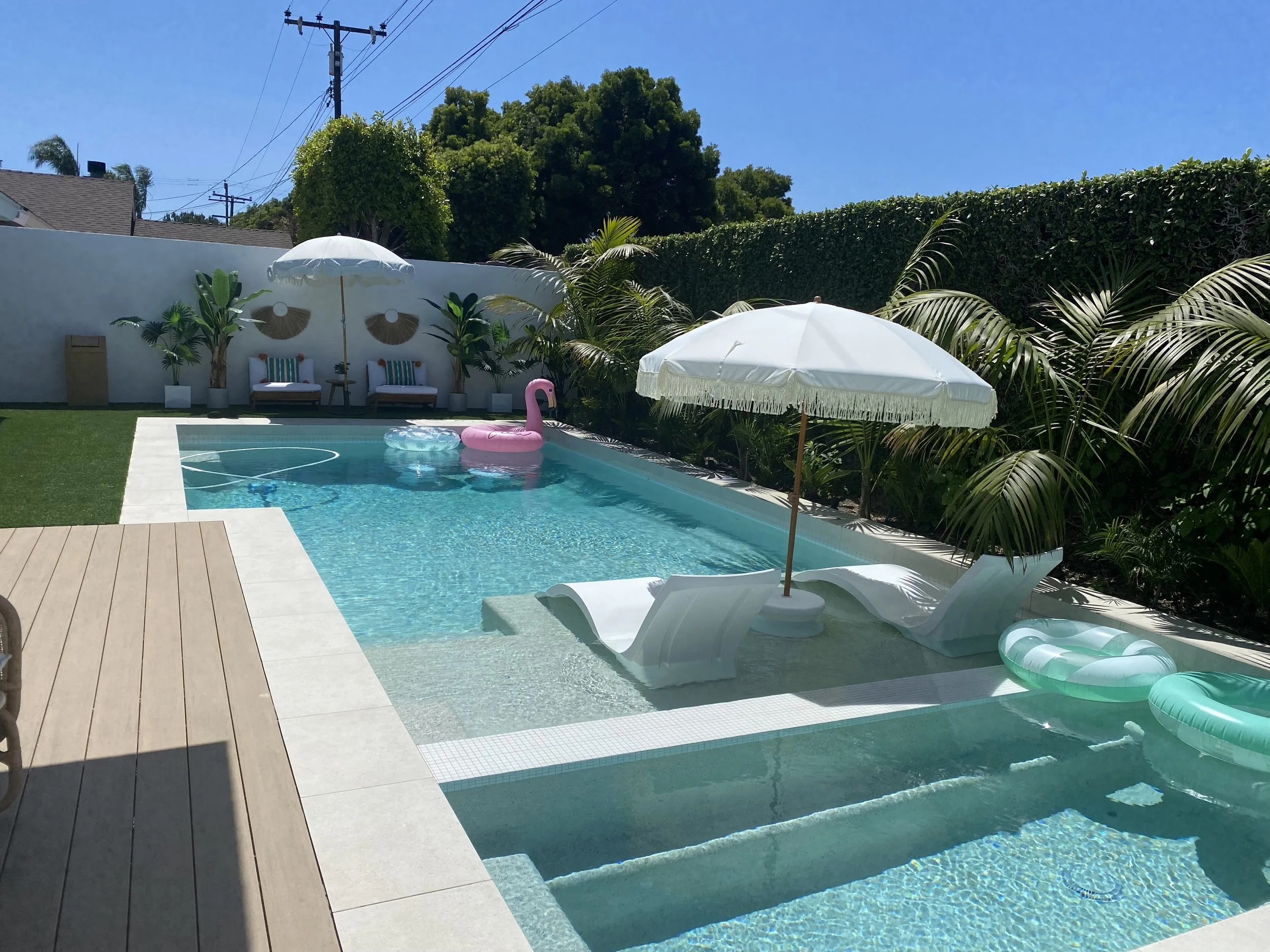Resort-style pool with tropical landscaping — JSQ Improvements Huntington Beach pool contractor
