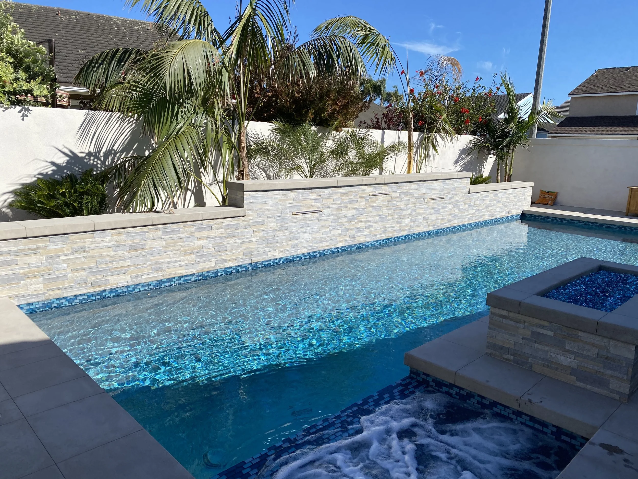 Backyard landscape design around custom pool — JSQ Improvements Huntington Beach